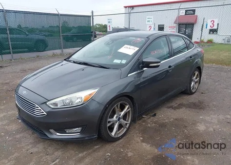 2016 Ford Focus Titanium z USA, uszkodzony, nr VIN 1FADP3J28GL251183